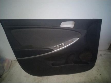 Обшивка (карта) водительской двери Hyundai Solaris
